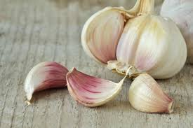 How can I remove the scar I have from using garlic to remove a mole?