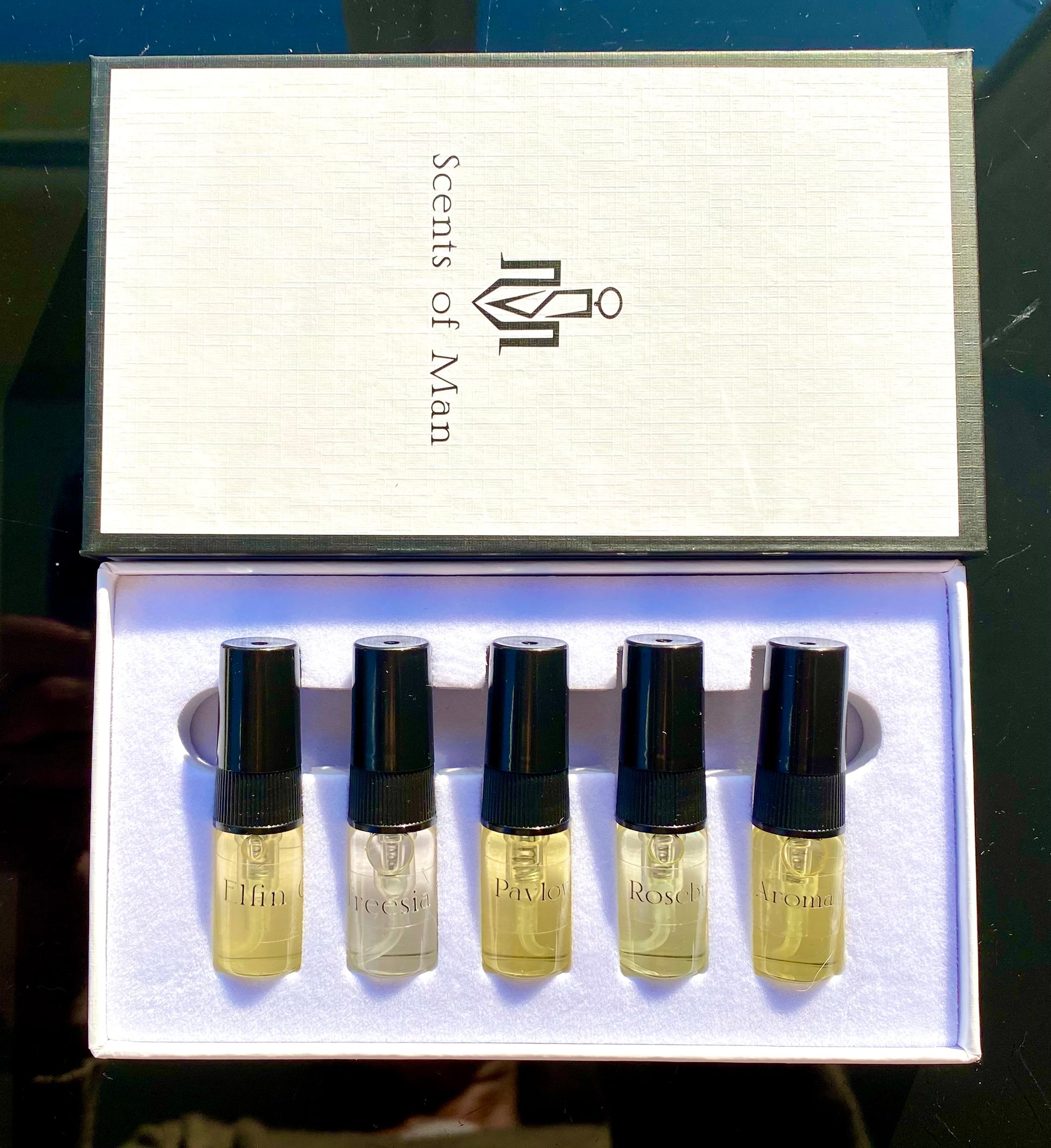 5 scent box, showing just the 5 glass spray bottles.